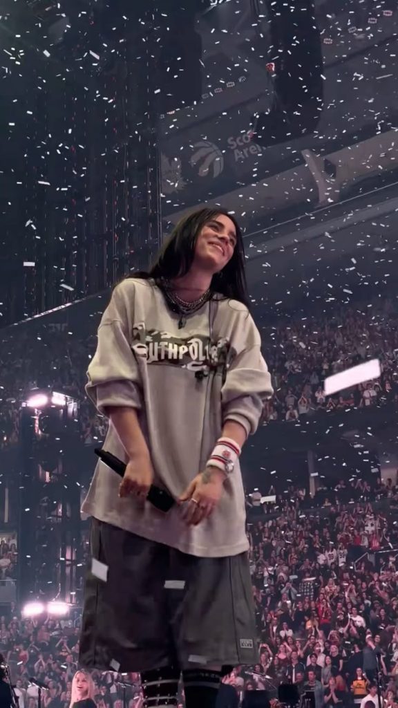 Billie Eilish performing live on stage