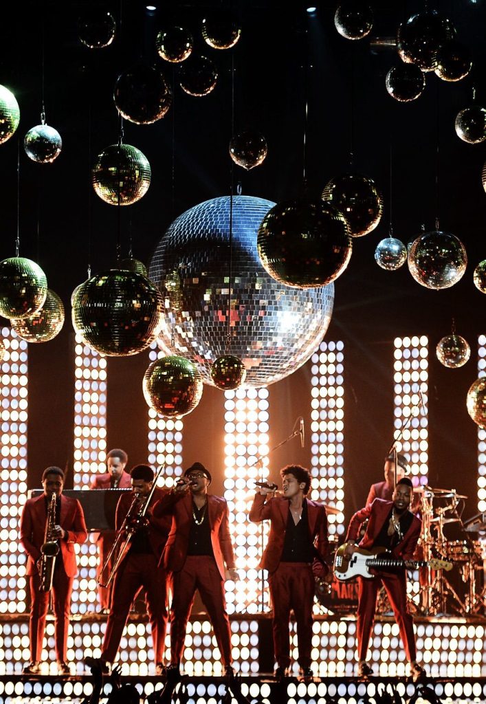Bruno Mars dancing during a live stage performance