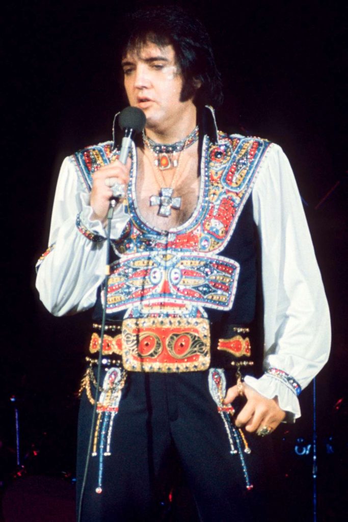 Elvis Presley performing on stage in 1977 during his final tour