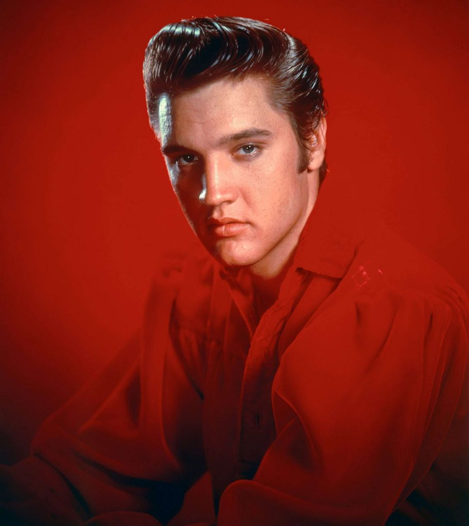 Young Elvis Presley performing during the early years of his career
