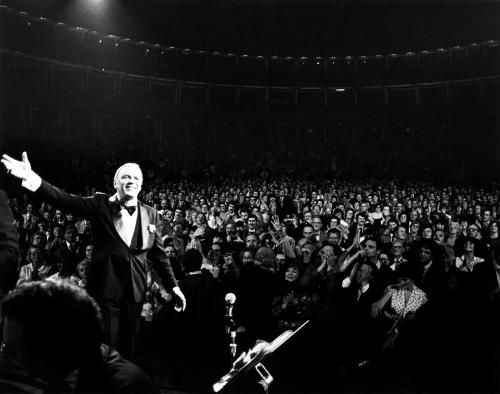 Frank Sinatra singing on stage during a concert