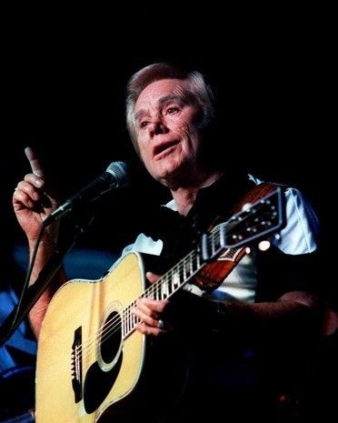 George Jones singing during a live country music concert