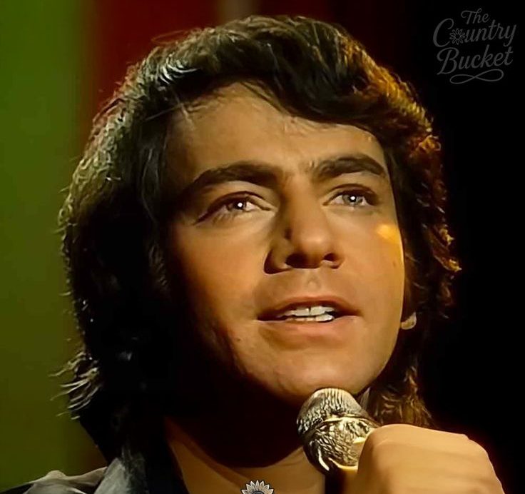 Neil Diamond performing Sweet Caroline during the late 1960s